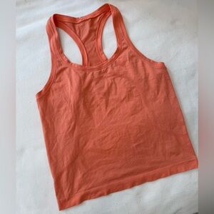 Peach colored Racerback Swiftly Waist Length Lululemon Tank Top
